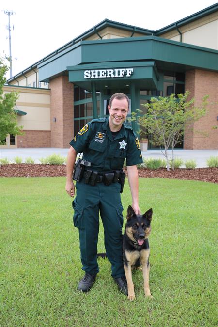 Whitaker and K9 Mako on SOC front lawn